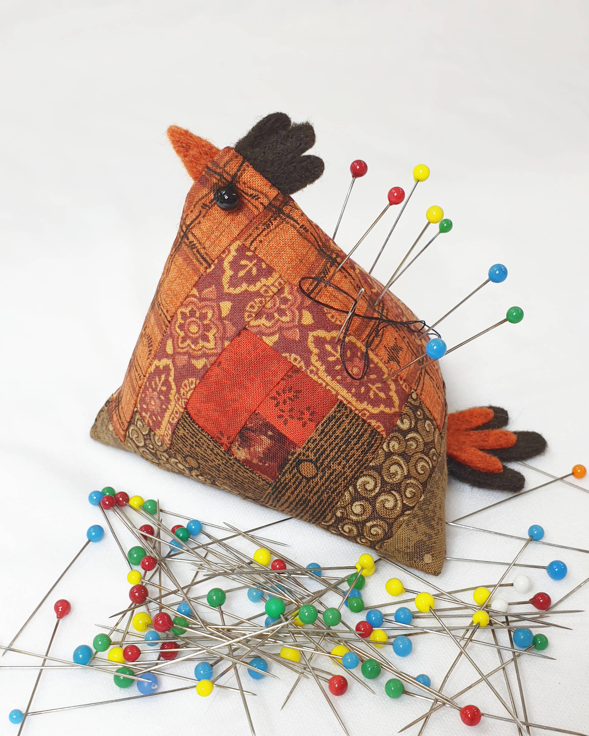 Orange and brown chicken pin cushion - Facing left