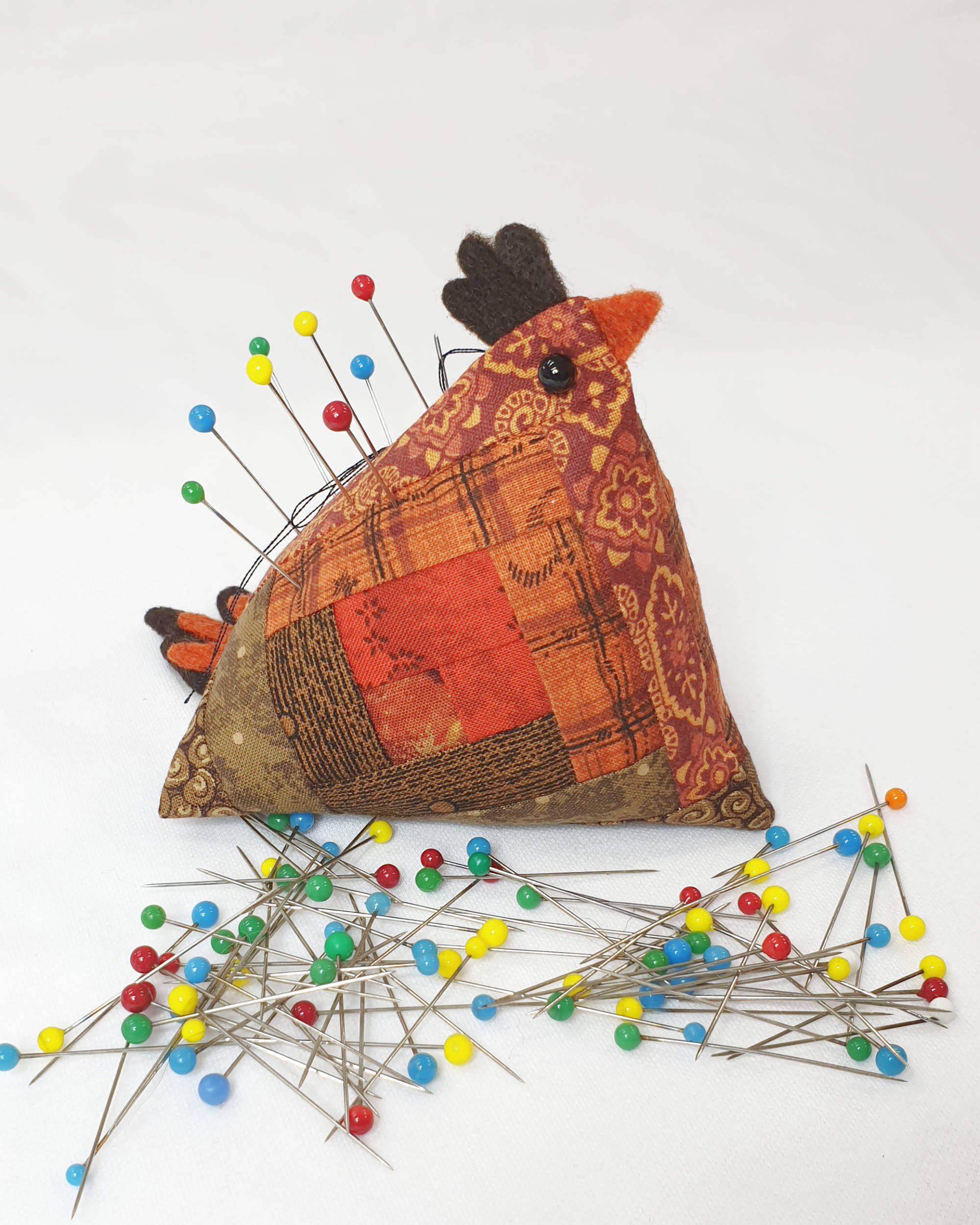 Orange and brown chicken pin cushion - Facing right