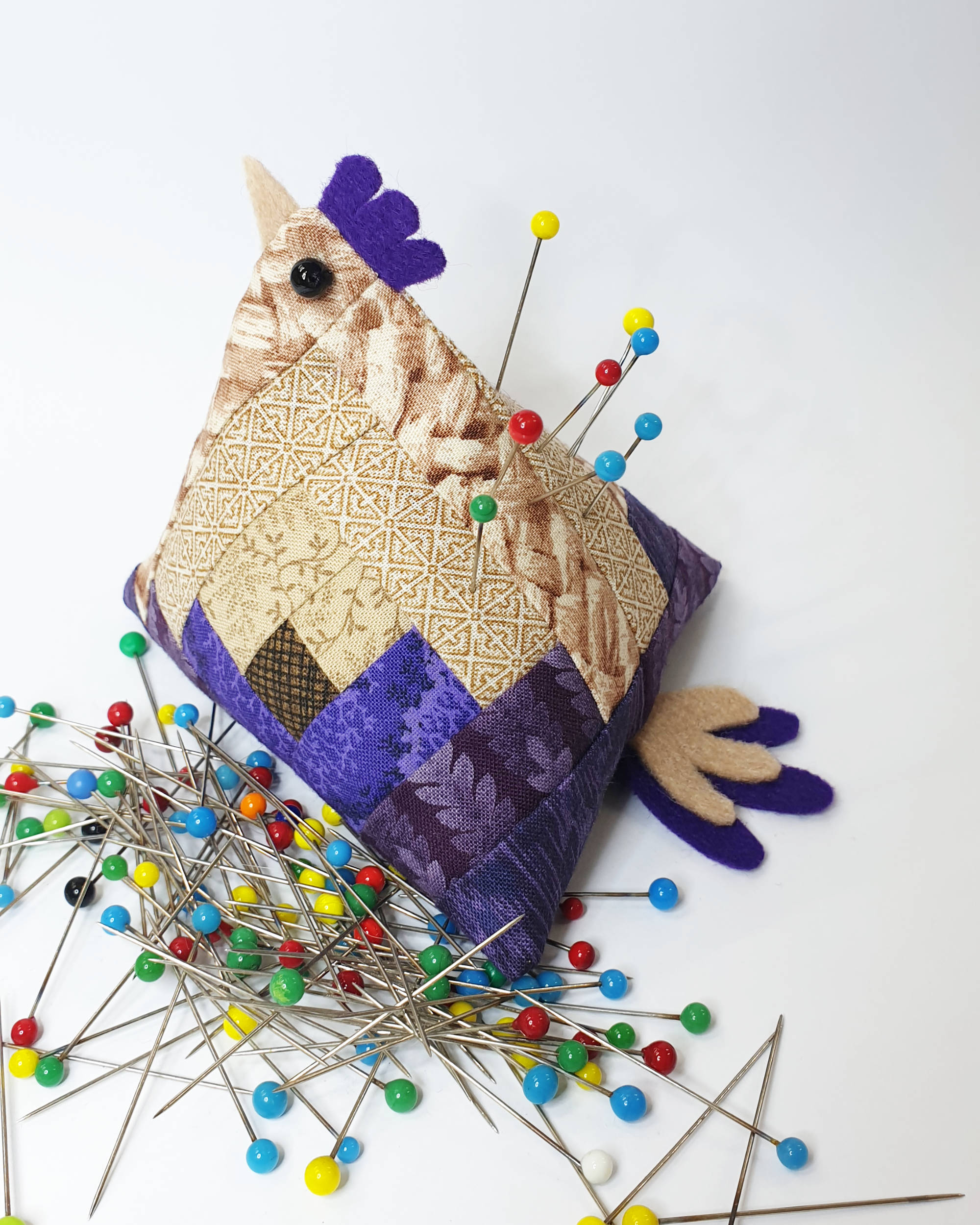 Tan and purple chicken pin cushion - Facing left